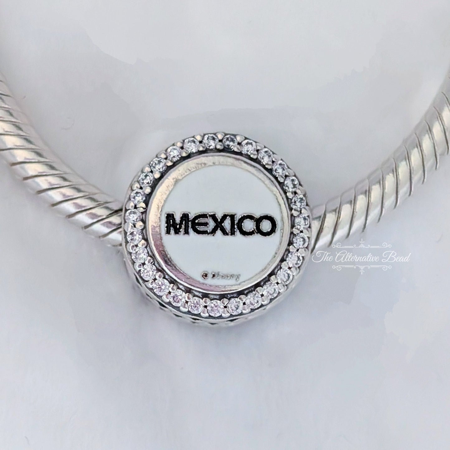 Disney x Pandora Mickey Mouse Mexico (EPCOT World Showcase) silver; white; blue; beige sterling-silver; enamel Bead by The Alternative Bead. Your official Disney x Pandora Retailer from Germany