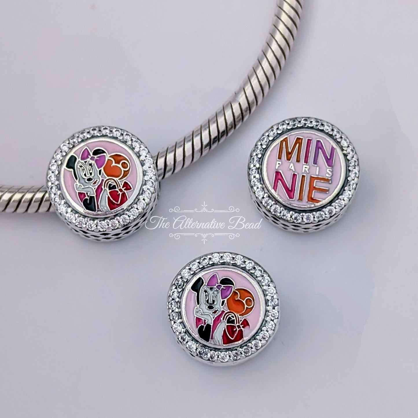 Disney x Pandora Disneyland Paris 30th Anniversary Minnie Paris Style pink sterling-silver; enamel Bead by The Alternative Bead. Your official Disney x Pandora Retailer from Germany