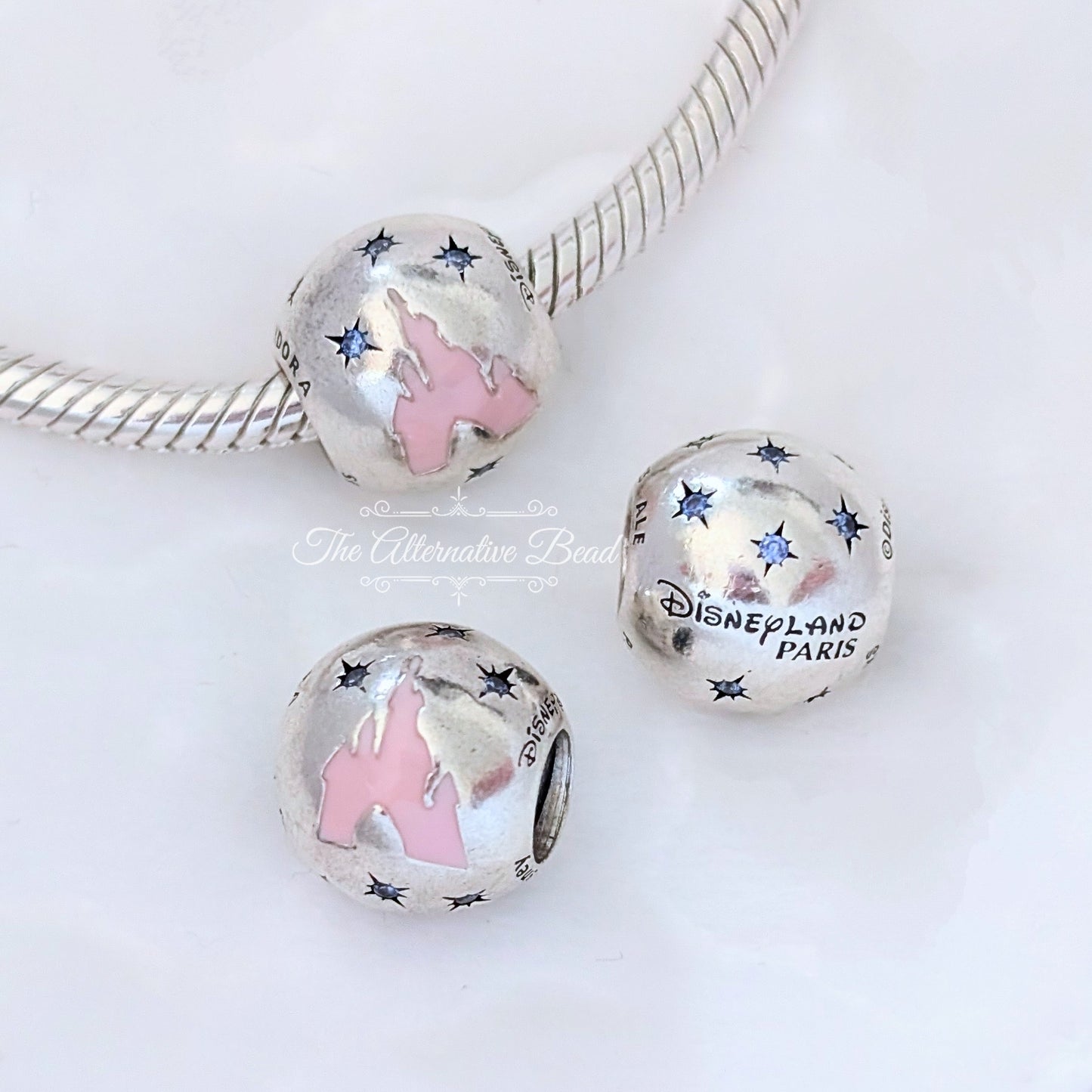 Disney x Pandora Disneyland Paris Silver Castle silver; pink sterling-silver; enamel Bead by The Alternative Bead. Your official Disney x Pandora Retailer from Germany