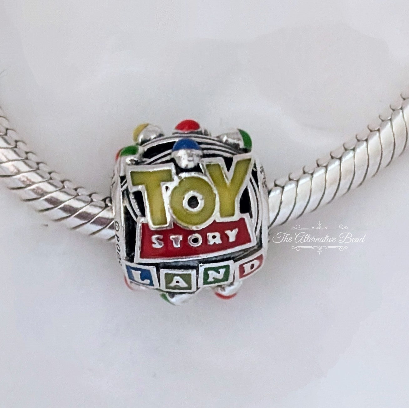 Disney x Pandora Pixar Parks Toy Story Land Charm silver; red; yellow sterling-silver; enamel Bead by The Alternative Bead. Your official Disney x Pandora Retailer from Germany