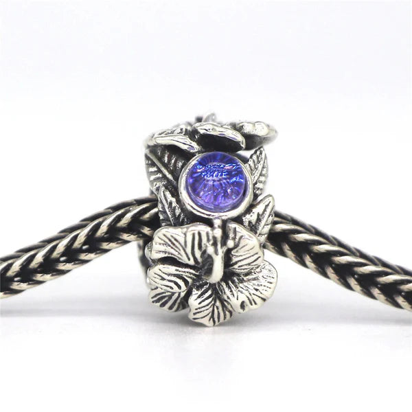 VIP-CHARMS Hibiscus Stopper Spacer Charm Bead (DG44) silver and blue glass and natural-stone and sterling-silver Stopper by The Alternative Bead. Your Official VIP-CHARMS Retailer from Germany