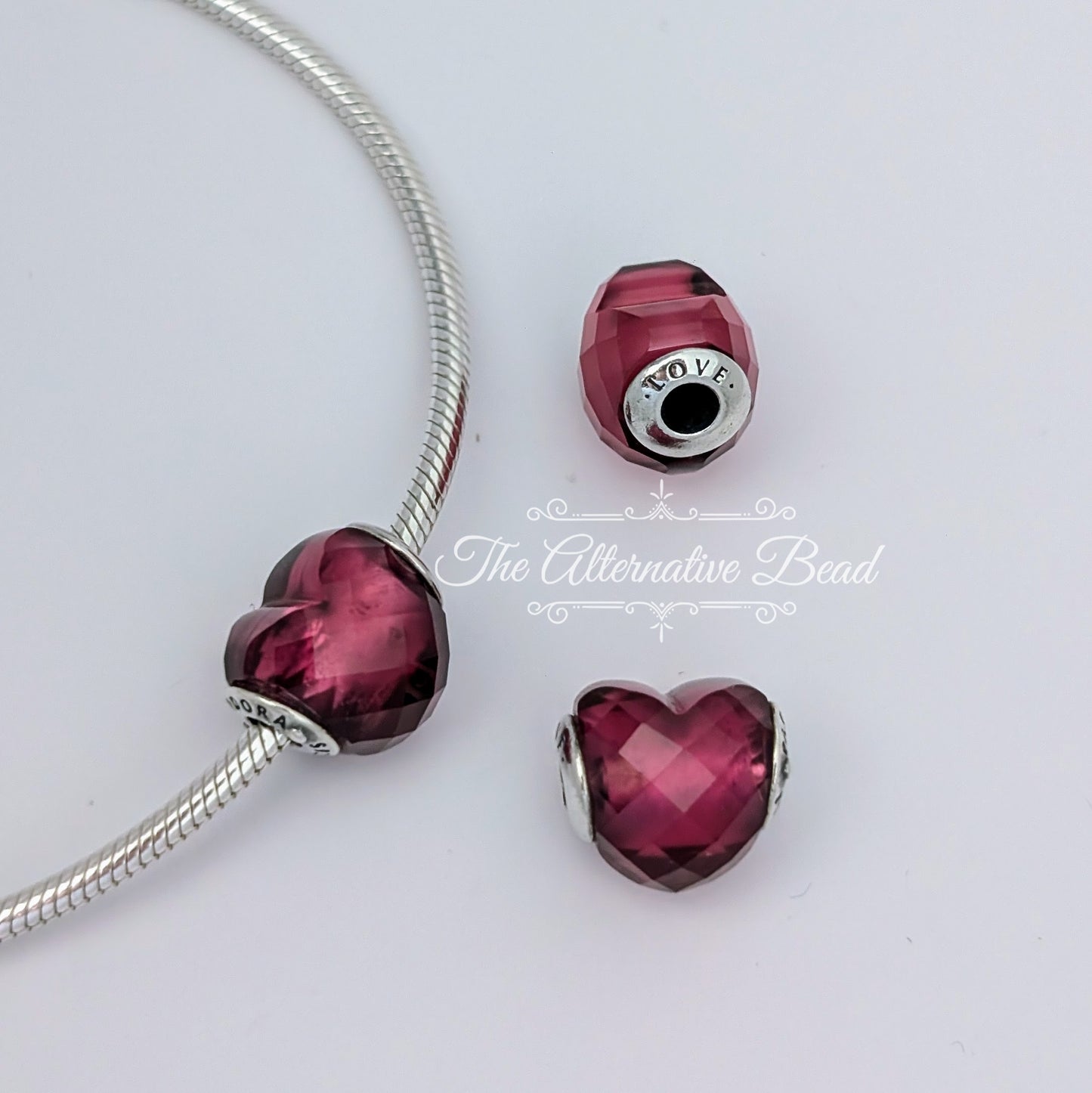 Pandora Essence Love Faceted Heart Charm pink glass Bead by The Alternative Bead. Your official Pandora Retailer from Germany