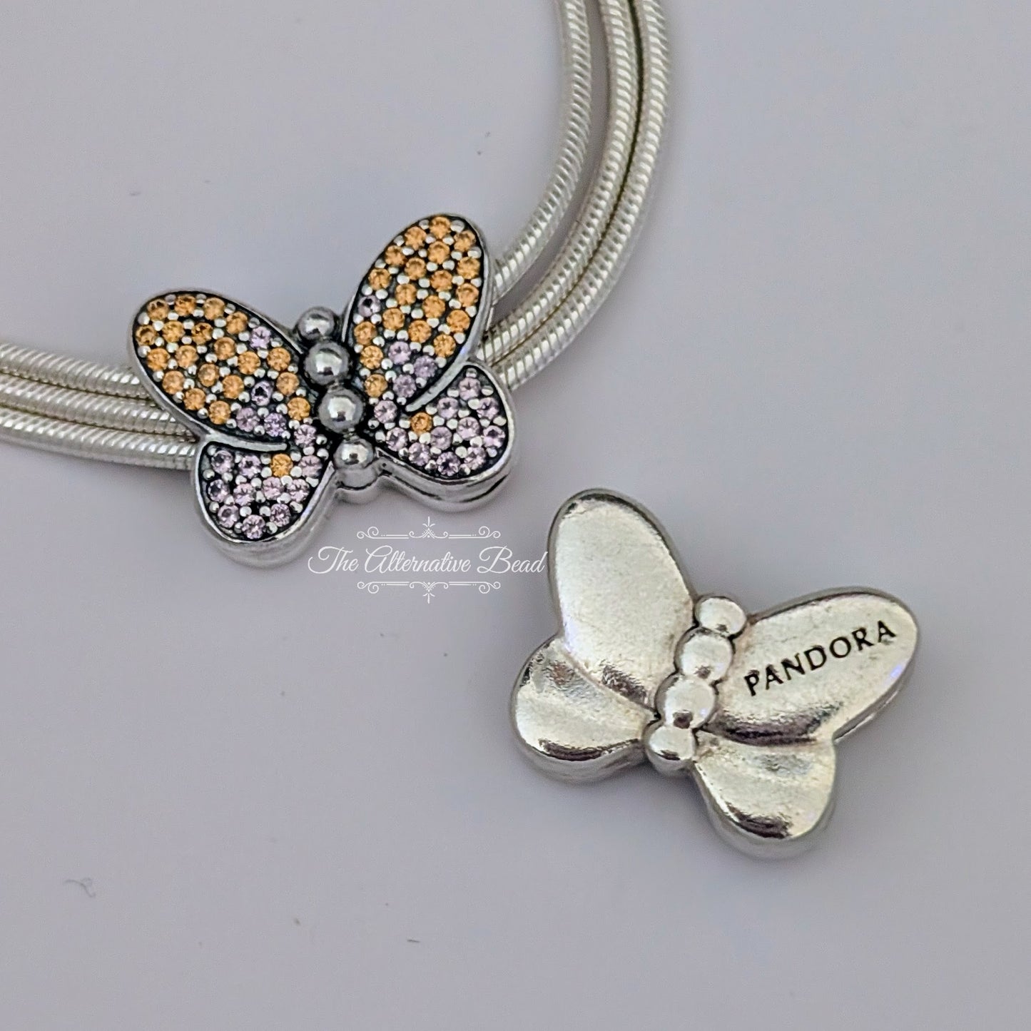 Pandora Reflexions Butterfly Clip pink; yellow sterling-silver Clip by The Alternative Bead. Your official Pandora Retailer from Germany