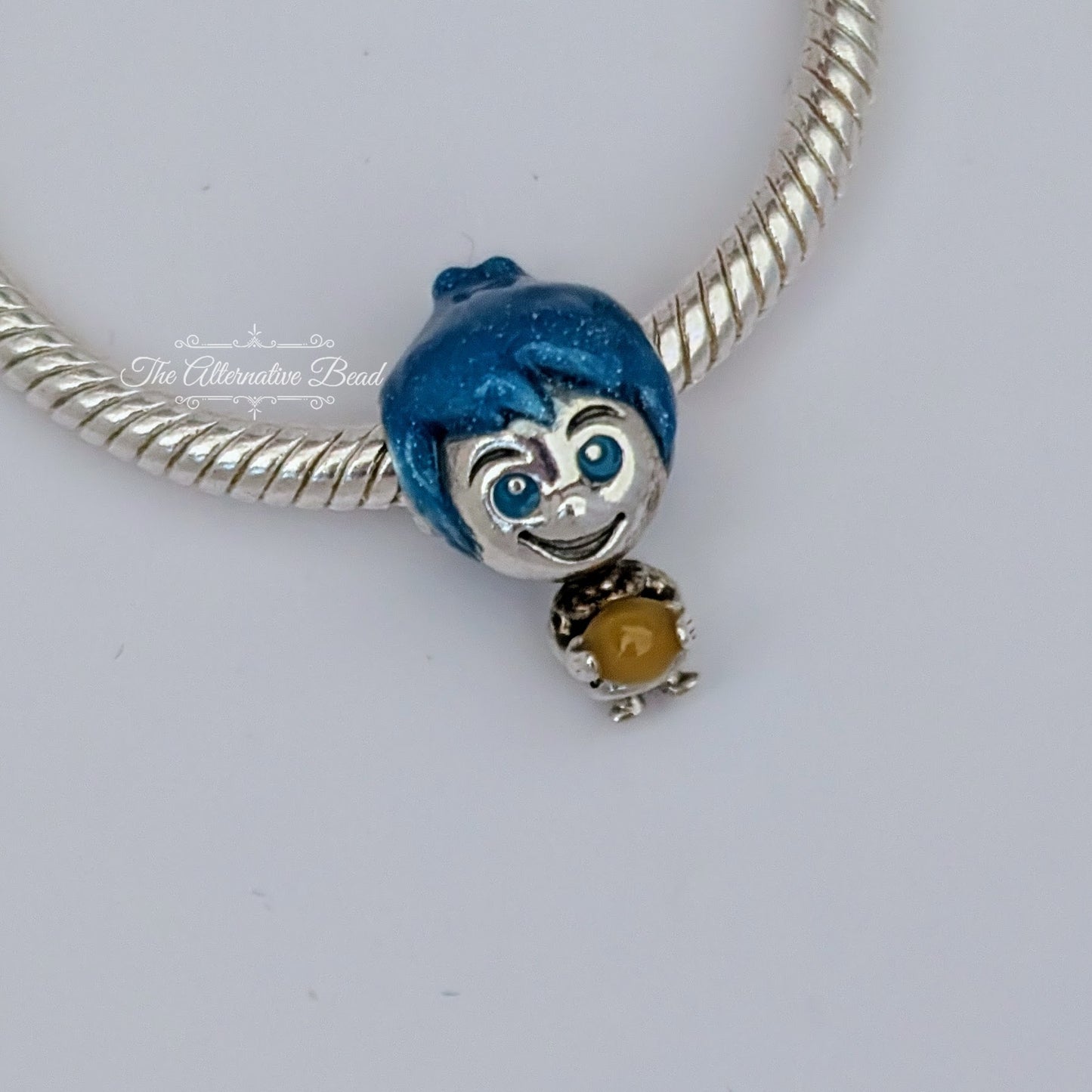 Disney x Pandora Pixar Joy Memory Orb blue; yellow sterling-silver Bead by The Alternative Bead. Your official Disney x Pandora Retailer from Germany