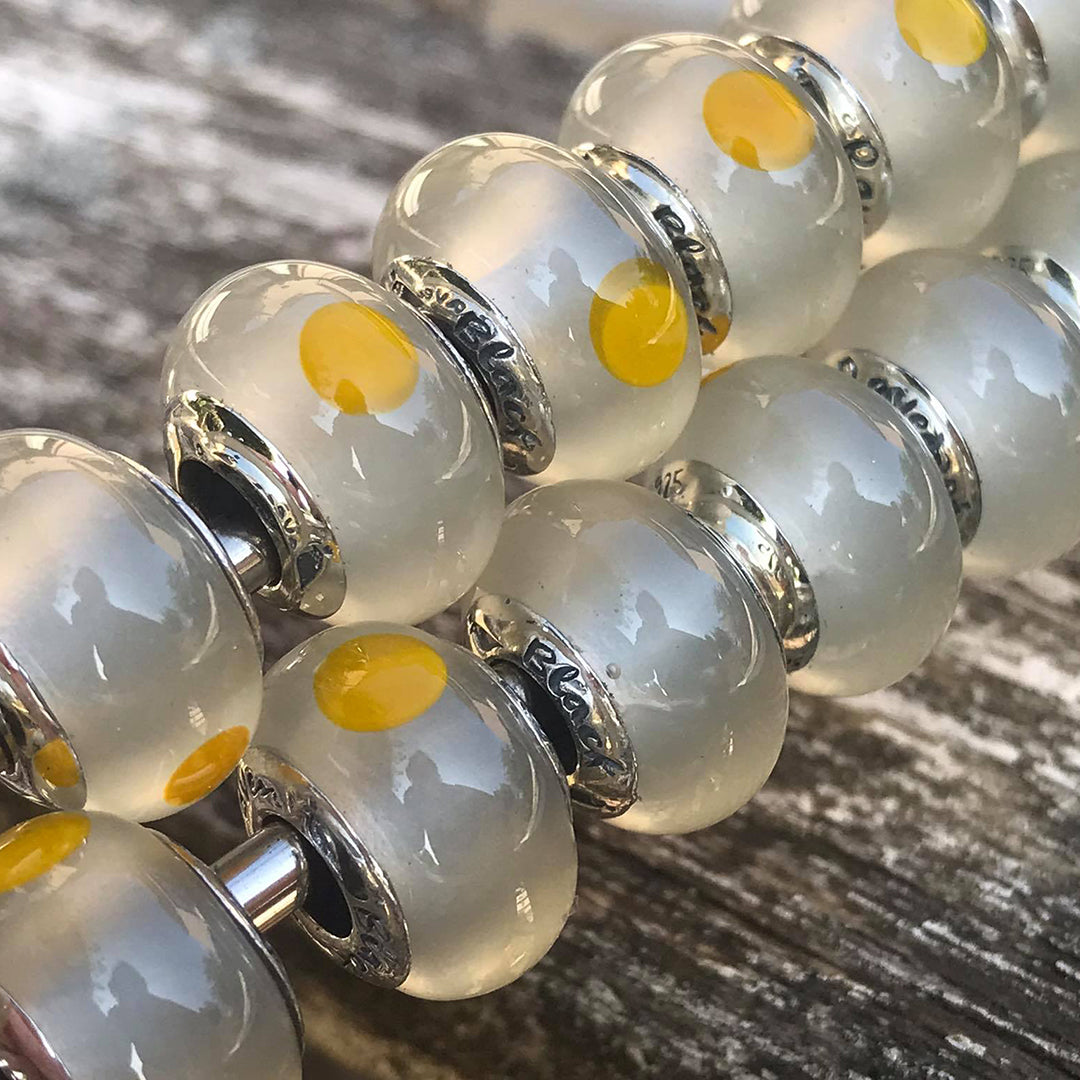 Black Raven Beads Egg white and yellow glass Charm by The Alternative Bead. Your official Black Raven Beads Retailer from Germany