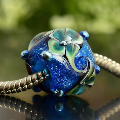 VIP-CHARMS Ocean Bloom Bead blue; green glass Bead by The Alternative Bead. Your official VIP-CHARMS Retailer from Germany