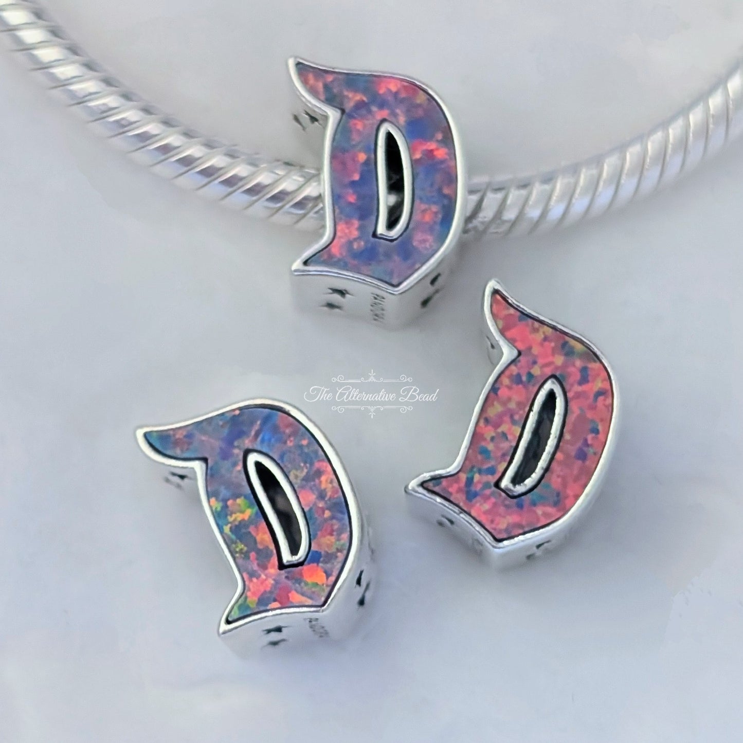 Disney x Pandora D Disneyland Logo Charm multicolor; silver; pink; purple sterling-silver; enamel Bead by The Alternative Bead. Your official Disney x Pandora Retailer from Germany