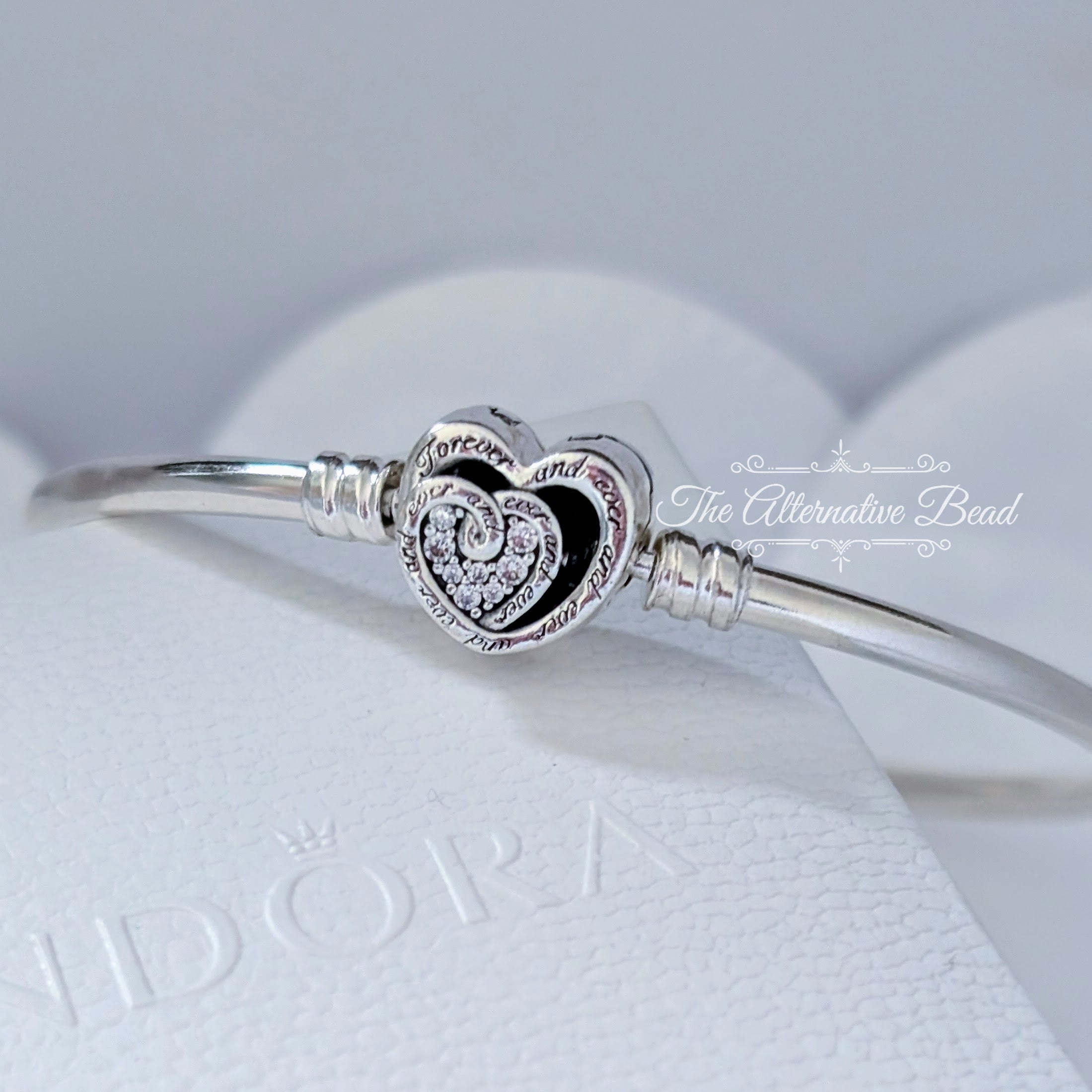 Pandora Moments Entwined Infinite Hearts Clasp Bangle (591064C01) silver sterling-silver Bangle by The Alternative Bead. Your Jewelry Retailer from Germany