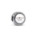 Silver charm with 'Czech Slovak Republic' text on a white background