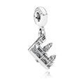 Silver charm with a detailed design on a white background
