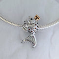 Pandora Fairytale fish silver charm with 14k, orange and golden coloured cubic zirconia and black crystal silver and gold sterling-silver and gold and crystal Bead by The Alternative Bead. Your Jewelry Retailer from Germany