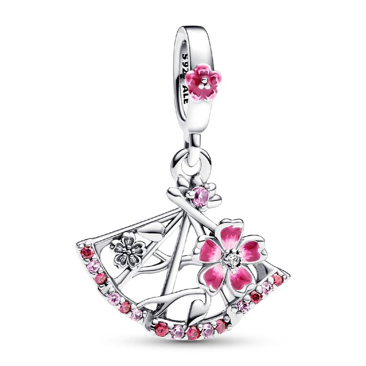 Silver pendant with pink floral designs on a white background