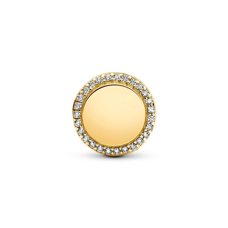 Gold round earring with clear stones on a white background
