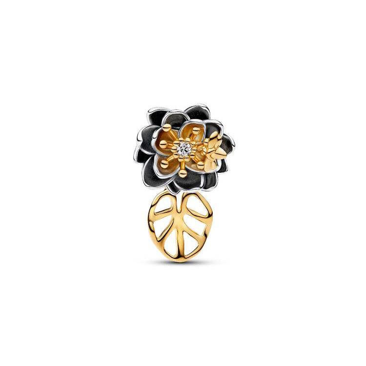 Gold and black floral earring on a white background