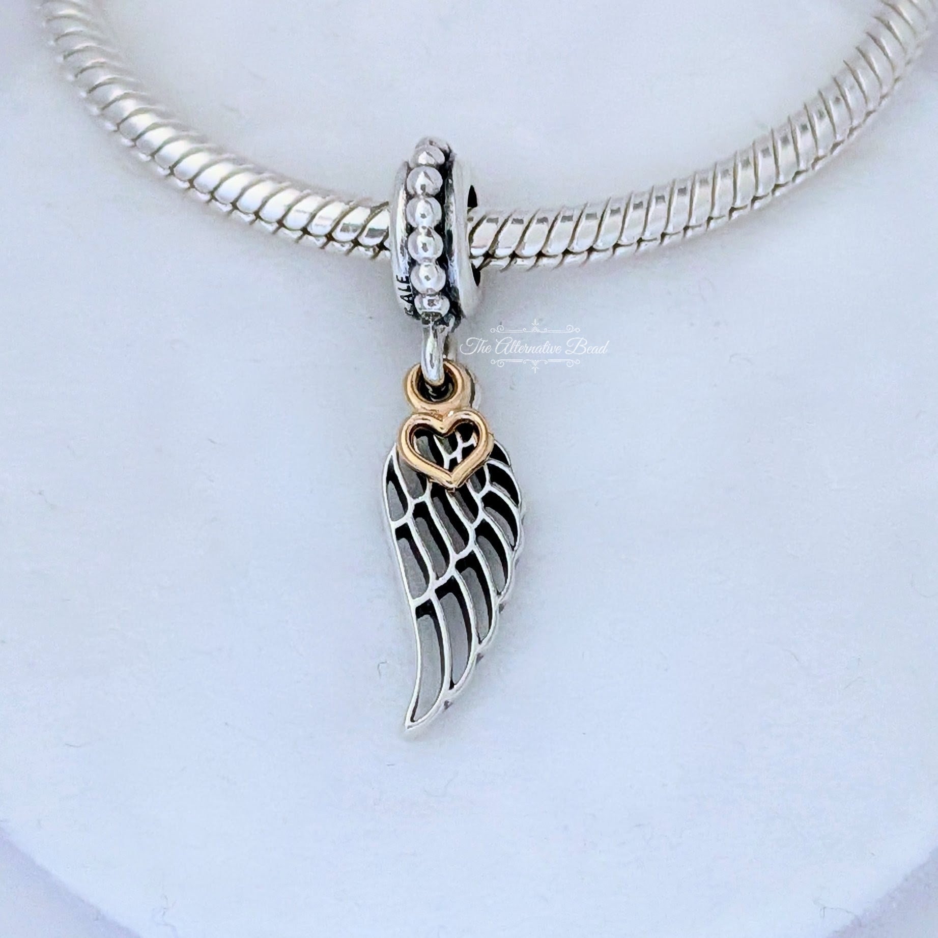 Pandora Angel wing silver dangle with 14k heart gold; silver sterling-silver; gold Dangle by The Alternative Bead. Your official Pandora Retailer from Germany
