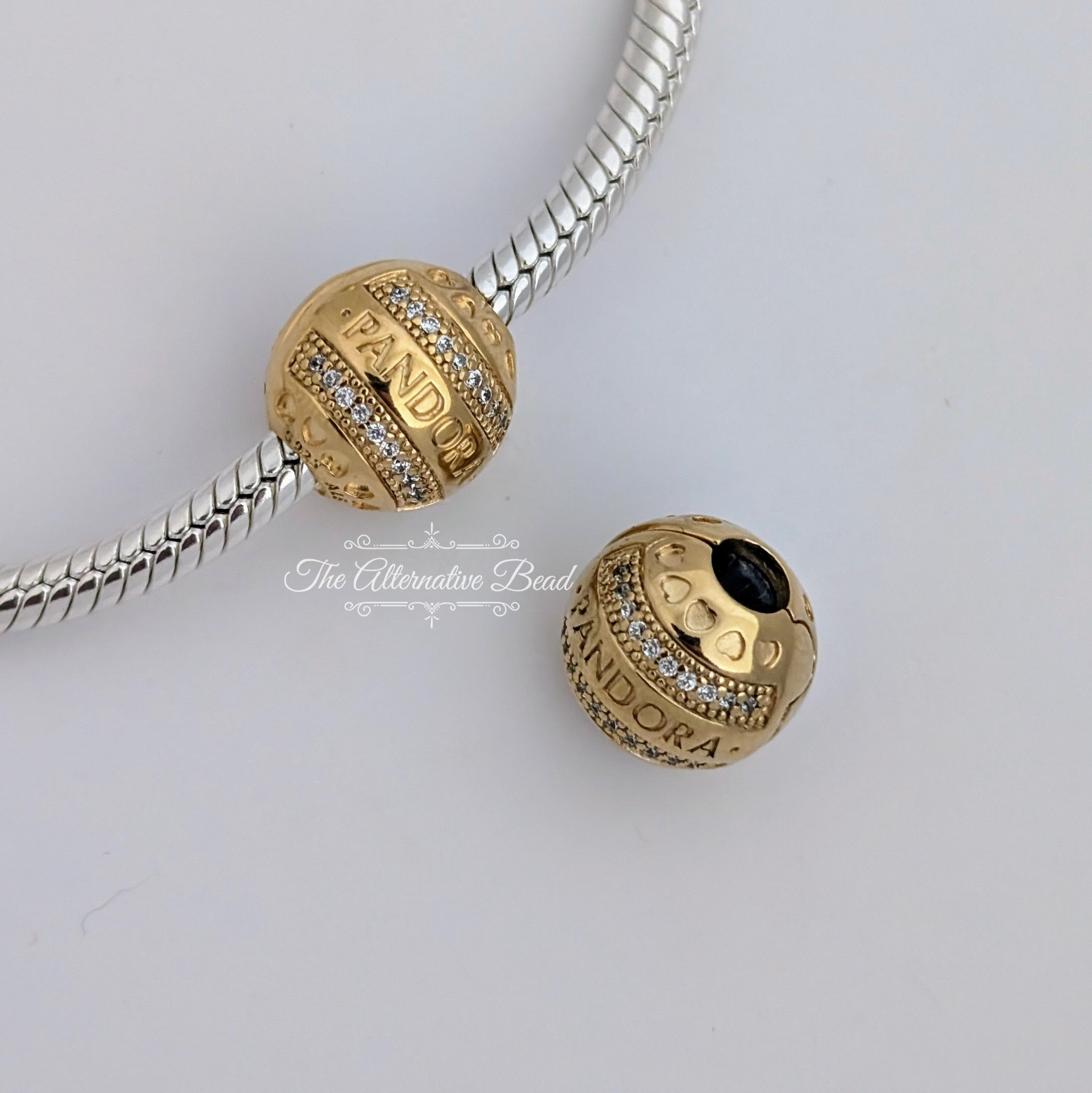 Pandora 14k Gold Plated logo clip with clear cubic zirconia and silicone grip (768663C01) gold gold Clip by The Alternative Bead. Your Jewelry Retailer from Germany