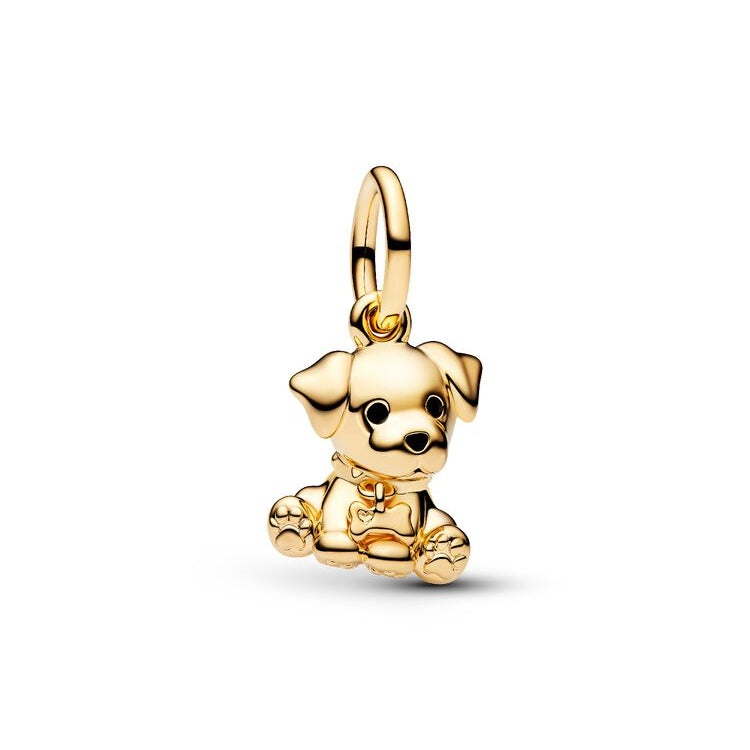 A polished gold puppy charm pendant with a detailed dog face, floppy ears, and a small bow tie, shown on a light gray background.