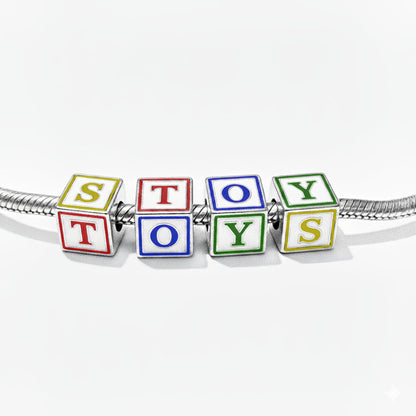 Colorful toy blocks spelling 'TOYS' on a white background